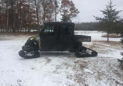 Side view of Polaris 900 with tracks