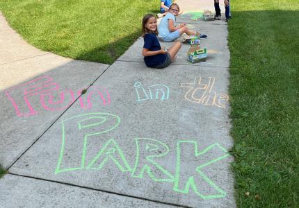 Fun in the Park written on the sidewalk