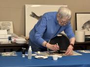 Crosslake artist Sonja Larsen demonstrates the Japanese technique of fish printing called Gyotaku