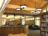 The warm, wood-accented interior of the Crosslake Area Library on a sleepy afternoon.