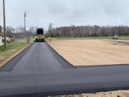 Anderson Brothers Asphalt crew applying the bituminous base course.