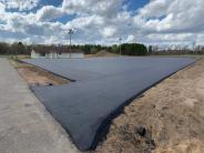 Anderson Brothers finished work of the grading, aggregate base, base course, tack and wear course.