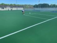 Lee Sports striping lines on the basketball court