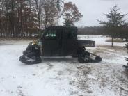 Side view of the Polaris 900 with tracks on