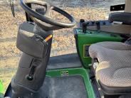 Inside the John Deere 1575 showing the steering column
